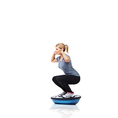 Image showing Woman, squat and exercise on bosu ball for workout, training or practice on a white studio background. Active female person on half round object for pilates, fitness or strong glutes on mockup space