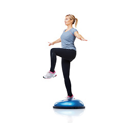 Image showing Woman, bosu ball or leg balance in workout for development isolated on white background. Female athlete, training equipment or fitness for studio mockup space, body challenge or exercise for wellness