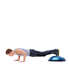 Image showing Man, push up for fitness and balance on bosu ball for core training, muscle and workout on white background. Exercise equipment, strength and endurance with mockup space and strong athlete in studio