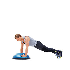 Image showing Man, fitness and half ball for plank in studio for training, strong exercise and gym with muscle health on floor. Person or young sports model in shoulder or arms workout on a white background