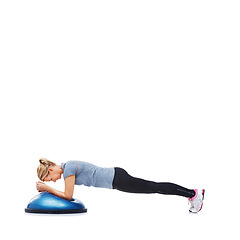 Image showing Woman, fitness and half ball for plank in studio for training, strong exercise and gym with muscle health on floor. Person or young sports model in shoulder or arms workout on a white background