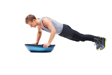 Image showing Man, fitness and half ball for push up in studio for workout, strong exercise and gym with muscle health on floor. Bodybuilder or young sports model with plank or arms training on a white background