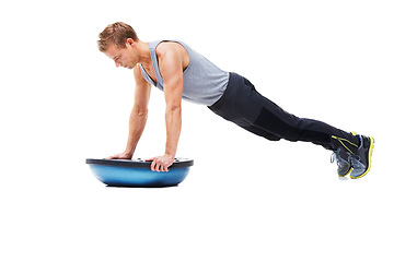 Image showing Man, training and half ball for push up in studio for workout, strong exercise and gym with muscle health on floor. Bodybuilder or sports model in plank or arms fitness balance on a white background