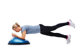 Image showing Woman, bosu ball and exercise or workout in studio, core strength and fitness challenge for wellness. Female person, athlete and equipment for training, healthy body and performance in sportswear