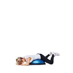 Image showing Woman, bosu ball and lying for workout, exercise or fitness on a white studio background. Young active female person or athlete on half round object for training, health and wellness on mockup space