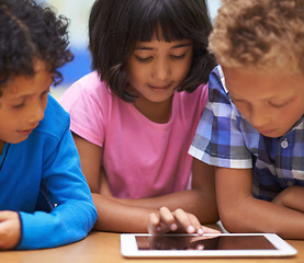 Image showing Students, children learning and tablet in classroom for online education, video streaming and information in group. Young kids with digital technology and scroll for knowledge and school development