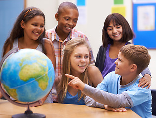 Image showing Students, kids with globe and learning map in classroom for education, teaching and quiz or group support. Happy children with planet earth, world and geography for 3d knowledge of history in school