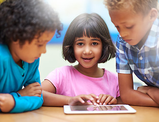 Image showing Girl, students learning and tablet in classroom for online education, teaching and information in portrait. Young kids with digital technology for school knowledge, internet and development software