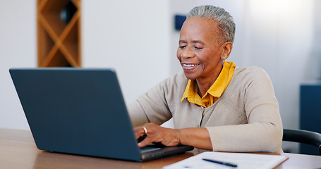 Image showing Happy senior woman, laptop and typing in finance with documents for bills or expenses in remote work at home. Mature African female person or freelancer smile on computer in financial budget at house