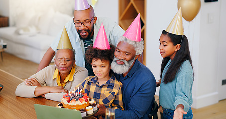 Image showing Video call, laptop and family at birthday party celebration together at modern house with candles and cake. Smile, love and young children with African father and grandparents for dessert at home.