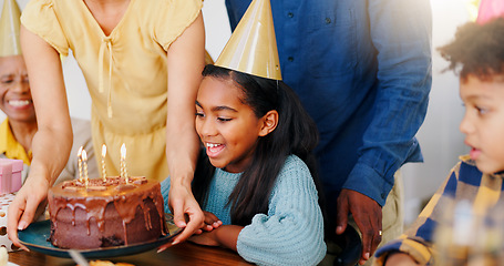 Image showing Cake, smile and family at birthday party celebration together at modern house with candles and hat. Happy, excited and young children with parents and grandparents for sweet dessert at home.