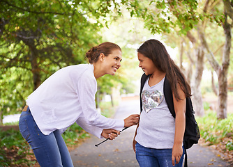 Image showing Woman, smile and student in park with bonding, preparation and wellness with love in city outdoor. Mother, daughter and helping with backpack, care and happy together for back to school in urban town