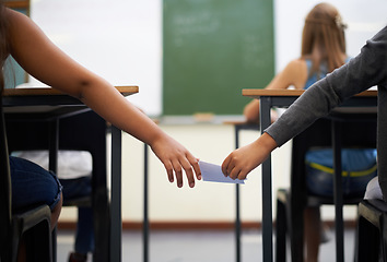 Image showing Hands, students or passing note for test in classroom, communication or secret at school for message. Education, learning or children in exam giving paper for cheating, answer or learners with letter