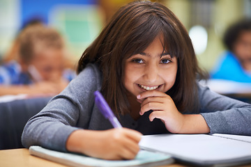 Image showing Girl, education and portrait in classroom for learning, information and notes for knowledge in school. Female person, book and pride for assessment or test, studying lesson and smiling at academy