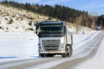 Image showing Silver Volvo FH Gravel Truck on Rural Road in Winter