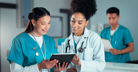 Image showing Team of doctors, discussion and women on tablet in hospital for research, report advice and telehealth. Healthcare, clinic and people talking on digital tech for medical service, results and meeting