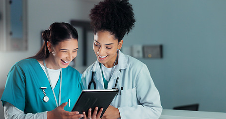 Image showing Team of doctors, discussion and women on tablet in hospital for research, report advice and telehealth. Healthcare, clinic and people talking on digital tech for medical service, results and meeting