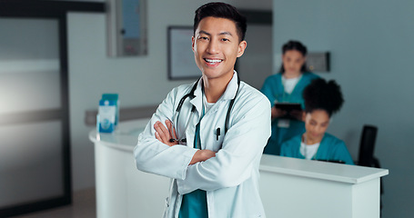 Image showing Happy, doctor arms crossed and Asian man, nurse or surgeon with career smile, job experience or pride. Hospital portrait, medical cardiology and professional healthcare worker for clinic support