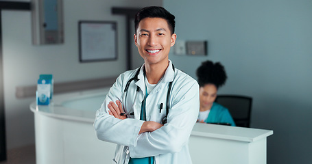 Image showing Happy, doctor arms crossed and Asian man, nurse or surgeon with career smile, job experience or pride. Hospital portrait, medical cardiology and professional healthcare worker for clinic support