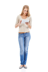 Image showing Woman, typing and tablet in studio with social networking, online blog and tech app with white background. News, email and digital scroll with information for web search, media and internet article