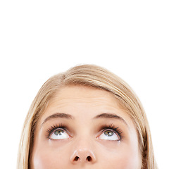 Image showing Thinking, eyes and woman in studio looking up at mockup for brainstorming on white background. Face, curious model and ideas for solution, problem solving or space for presentation, choice and vision