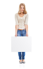 Image showing Portrait, woman and promotion with blank poster, review or opportunity isolated on a white studio background. Joy, person or model with mockup space, announcement or billboard with feedback and smile