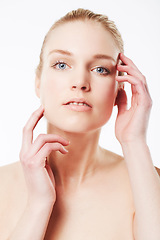 Image showing Portrait of model, touching face or beauty for wellness with cosmetics, aesthetic or healthy glow. Facial dermatology, studio or confident woman with pride or skincare results on white background