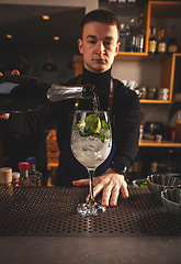 Image showing Bartender pouring champagne