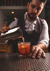 Image showing Barman preparing luxury drink