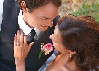 Image showing Couple, romance and wedding ring for love in outdoors, together and devotion to marriage and commitment. Happy people, smile and union or relaxing on grass, loyalty and pride for partnership at event