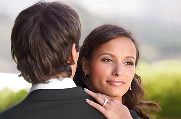 Image showing Couple, dancing and embrace on wedding day for love, support and excited for marriage and commitment. People, romance and hugging at outdoor ceremony, loyalty and pride for ring and partnership