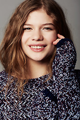 Image showing Smile, beauty and portrait of woman in a studio with makeup, cosmetic and glamour face. Confident, happy and young beautiful female model with hairstyle for fashion isolated by gray background.