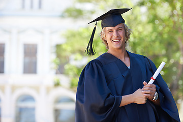 Image showing Graduation, portrait and happy man on campus with certificate, smile and success with university education. School, scholarship and student with diploma for academic achievement with college degree.