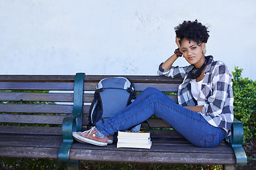 Image showing Woman, portrait and student on bench with book for university study, education or reading. Female person, face and smile at college campus outdoor for knowledge, scholarship or research literature