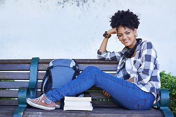 Image showing Woman, portrait and university bench with book for diploma study, education or reading. Female person, face and student at college campus or outdoor for knowledge, scholarship or research literature