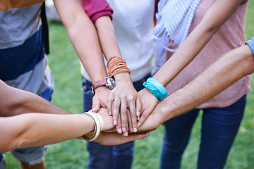 Image showing People, teamwork and hands together of friends outdoor for support, solidarity or mission of success, synergy or winning. Closeup, community group or collaboration at park for trust, kindness or help