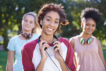 Image showing College, students and portrait in the park with headphones on campus to study together with happiness and friends. University, academy and people with diversity or solidarity in education mission