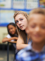 Image showing Girl, classroom and writing for learning, elementary school and diverse children workbook. Students, study and childhood development for education, knowledge and academic information for people