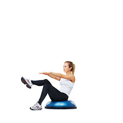 Image showing Woman, workout and sitting on half ball for exercise, fitness or training on a white studio background. Active female person on balance object for pilates, practice or strong core on mockup space