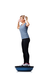 Image showing Woman, balance ball and standing for fitness, exercise or workout on white studio background. Active female person or athlete on half round object for training, health and wellness on mockup space