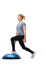 Image showing Training, half ball and woman doing lunge for coordination, physical exercise or legs strength performance. Muscle fitness, balance platform and studio person in stability workout on white background