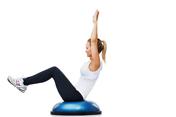 Image showing Woman, half ball and sitting in fitness, balance or exercise on a white studio background. Young active female person or athlete on half round object in training, health and wellness on mockup space