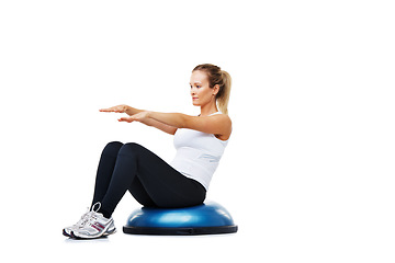 Image showing Sports, half ball and young woman in a studio for stretching body workout or training with balance. Sports, equipment and female person with muscle warm up exercise isolated by white background.