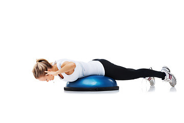 Image showing Fitness, half ball and woman stretching in a studio for balance body exercise or workout for health. Sports, health and young female person with training on equipment isolated by white background.