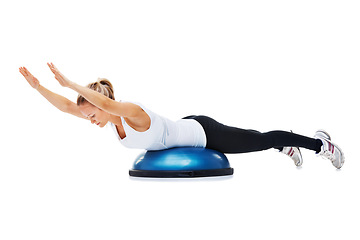 Image showing Sports, bosu ball and woman stretching in a studio for body workout or training with balance. Fitness, equipment and young female person with muscle warm up exercise isolated by white background.
