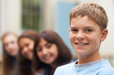 Image showing Boy, portrait and happy outdoor at school with confidence and pride for learning, education or knowledge. Student, person and face with smile in building or college before class or ready to study