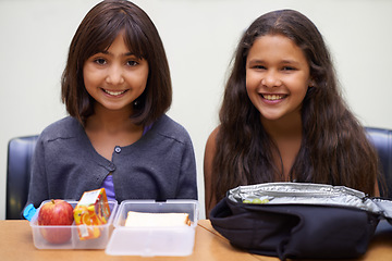 Image showing Girl, friends and portrait with lunch at school for recess, break or nutrition at table and happy. Kids, face and smile at academy or relax with confidence, food or pride for childhood development