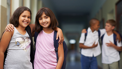 Image showing Girl, portrait and happy in corridor with friend or backpack for learning, education or knowledge at school. Student, person or face with smile in building or hallway before class or ready to study