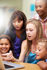 Image showing Young tutor, laptop and teaching kids, children or pupils technology, social media or research in class. Group of elementary students with mentor showing tech, internet or online search in classroom