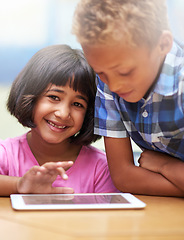 Image showing Happy children, tablet and classroom for elearning, education or online lesson together at school. Young boy, girl or elementary kids smile on technology for games, entertainment or virtual class